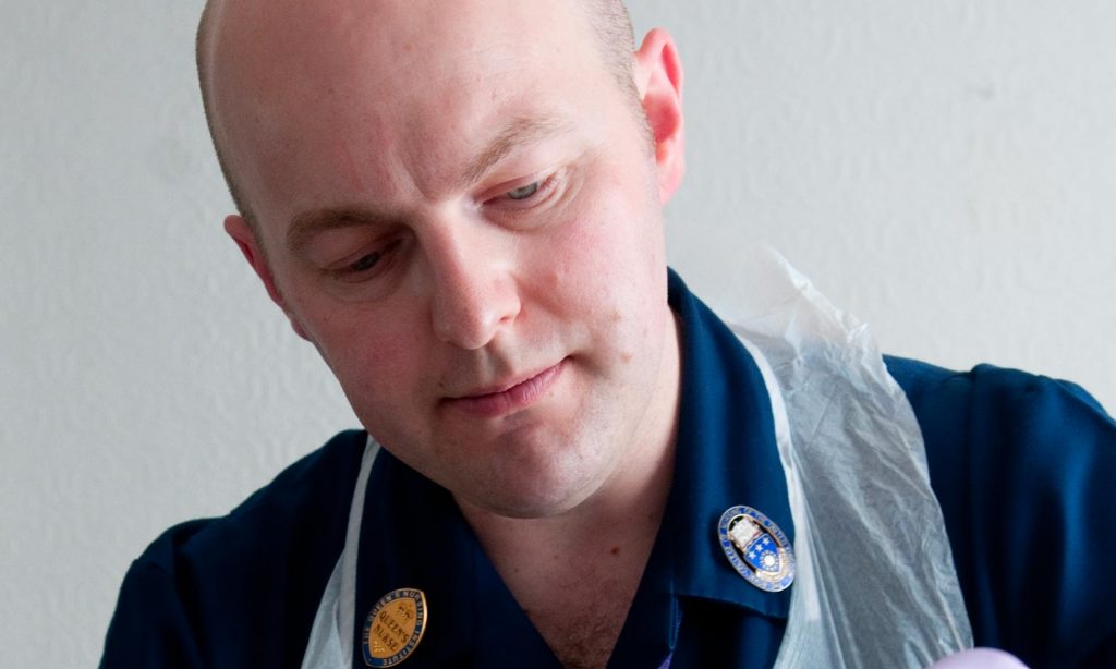Image of a male district nurse