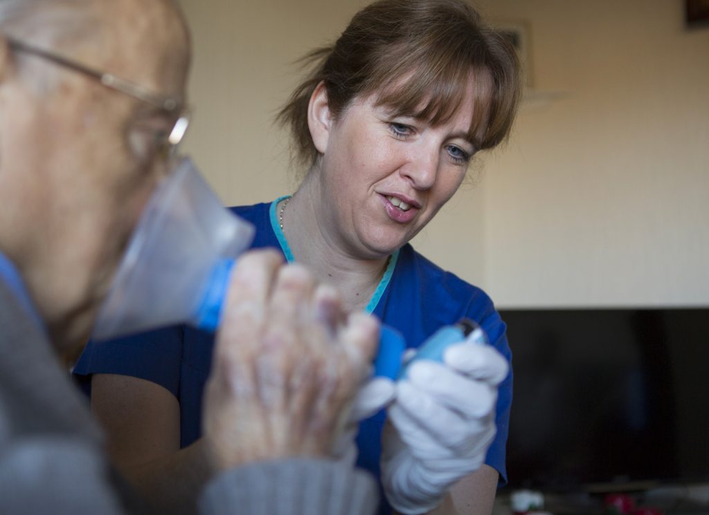 Nurse with an asthma patient