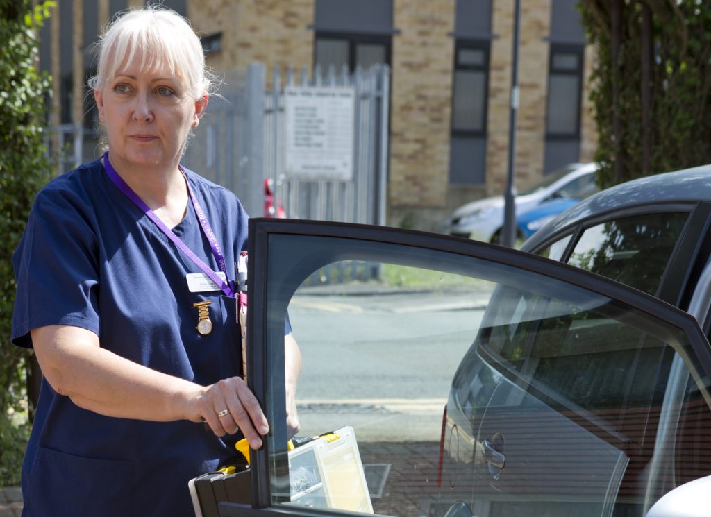 District Nurse by car door