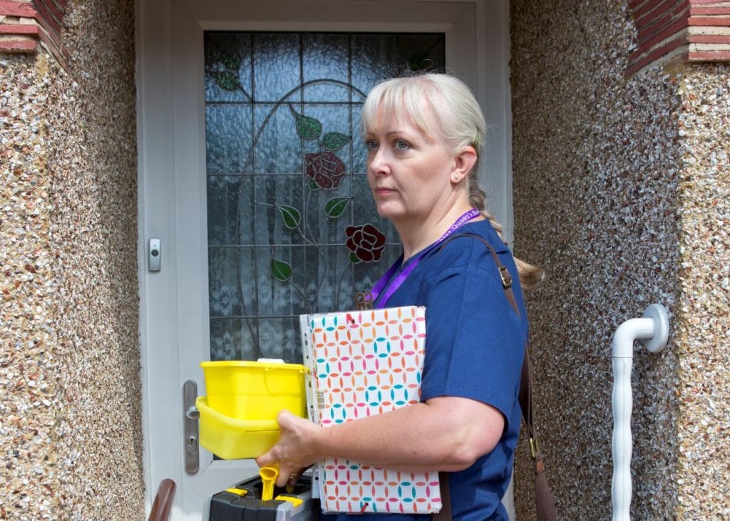 District Nurse in the doorway