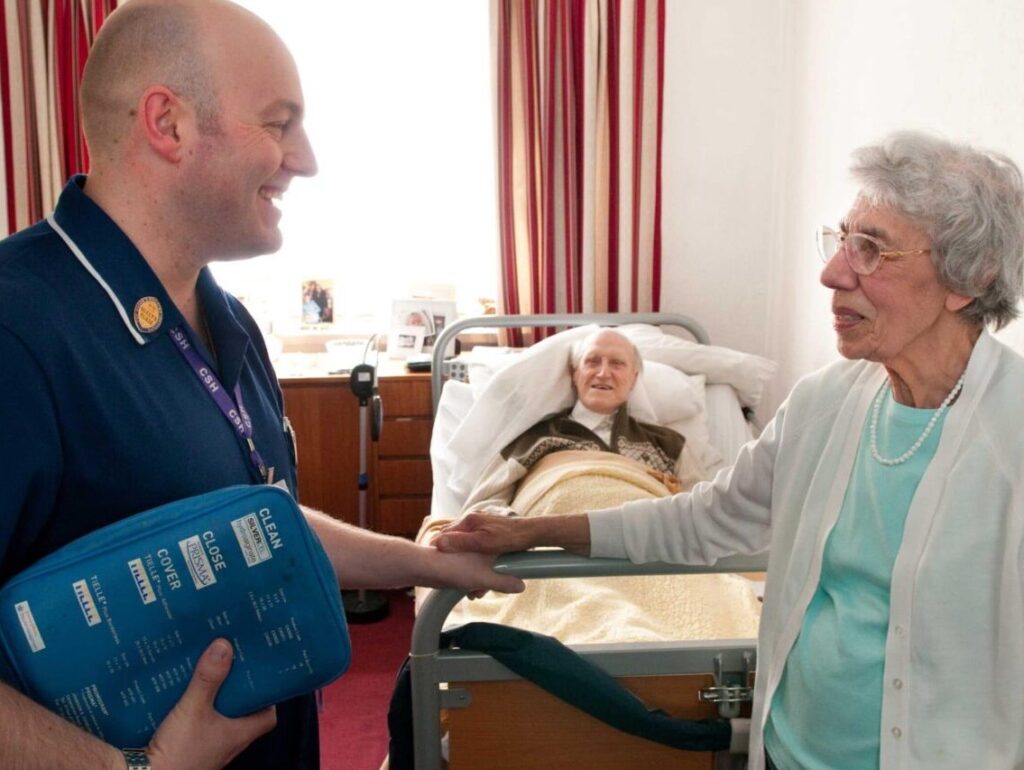 Nurse talking to an elderly patient