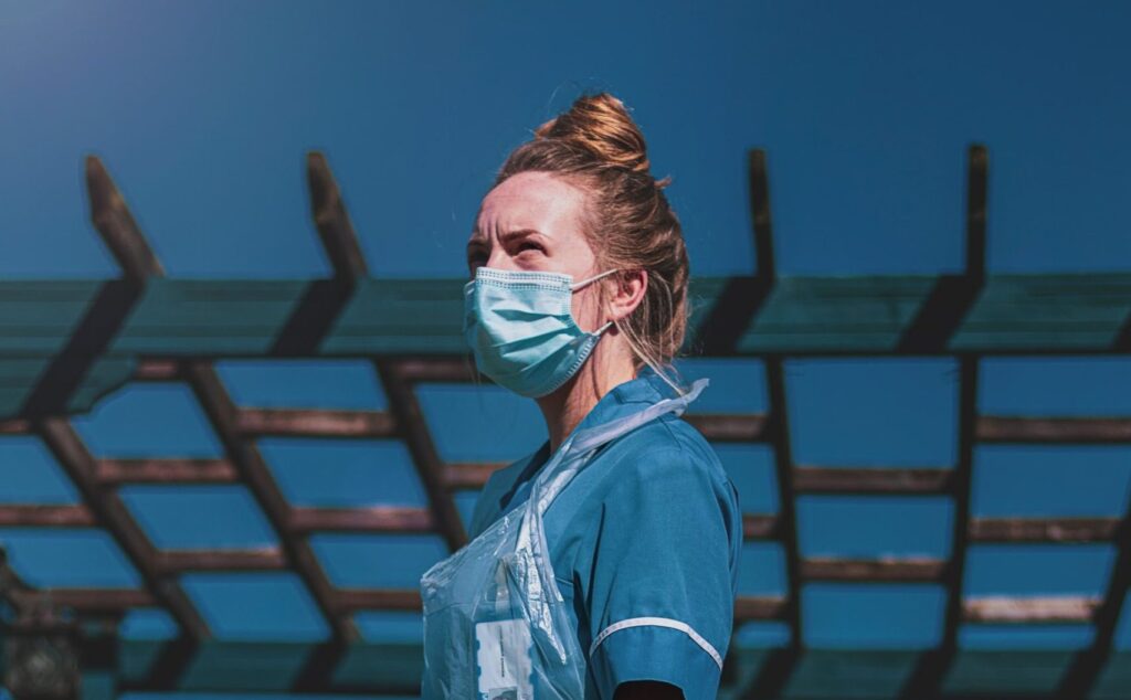 NHS nurse staff in personal protection equipment (PPE) Key worker