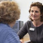 General Practice Nurse talking to a patient