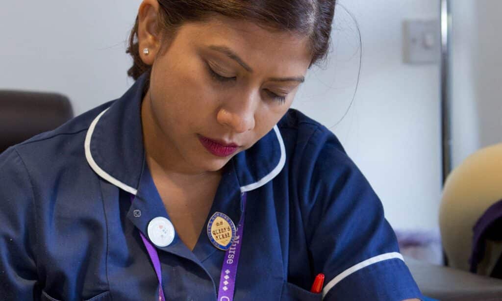 Queen’s Nurse Sharel Cole writing